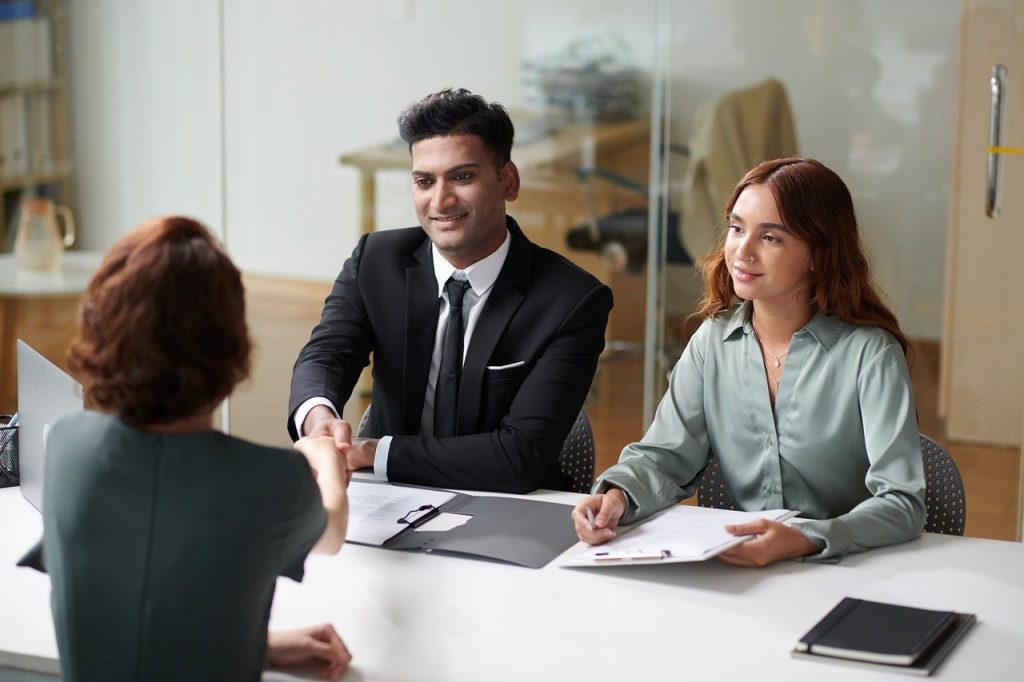 job-interview-one-candidate-faces-two-interviewers-across-a-desk